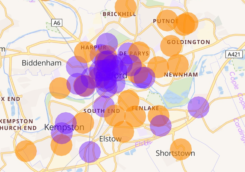 A map of the main urban area of Bedford and Kempston. Areas served by existing chargepoints are shown as purple circles, and areas to be served by proposed new chargepoints are shown by orange circles. The orange circles cover a significant extra area in addition to the purple circles.