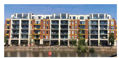 An image of the Riverside residential apartment building in Bedford. The different sized windows break up the mass of the façade. 