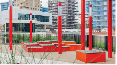 An image showing an integrated public art installation with high rise tower blocks in the background. 